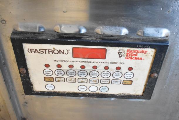 Stainless steel commercial pressure deep fat fryer with Fastron microprocessor controls. Kentucky Fried Chicken branding. Serial no. 180048.