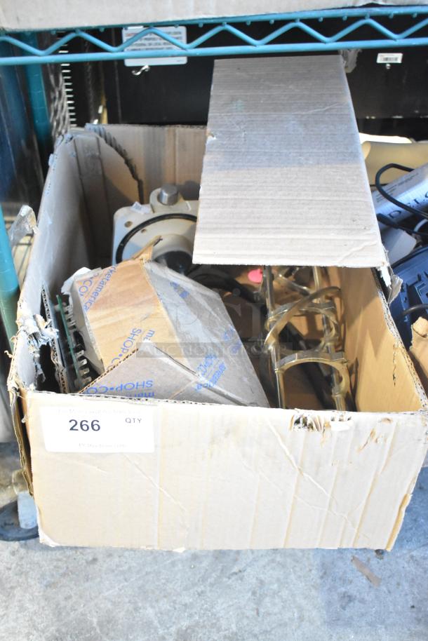 Box of various parts including an ice cream machine auger, miscellaneous components; label marked "266 QTY," worn condition.