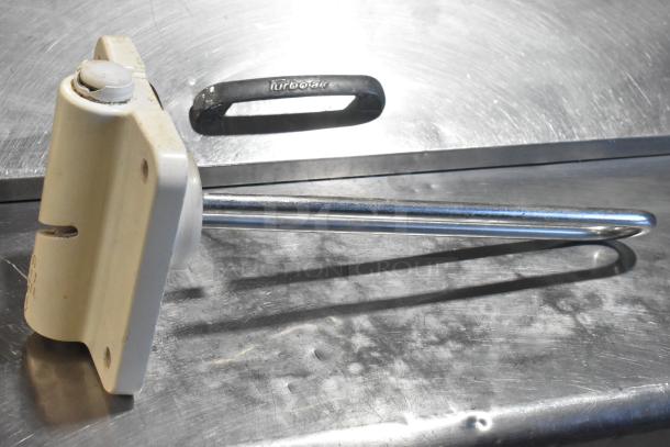 Lot of various parts including an ice cream machine auger and TurboAir branded piece shown on a metal surface.