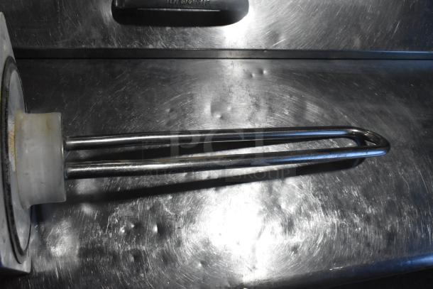 ALL ONE MONEY! Lot featuring ice cream machine auger and various parts; stainless steel with light wear.