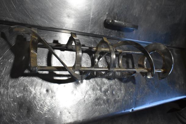 Lot including metal ice cream machine auger on metal surface; item appears used, suitable for parts or repair.