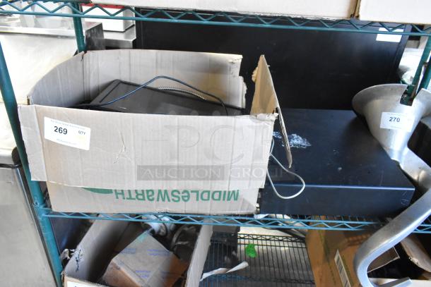 Cardboard box containing metal cash drawer and cables, labeled "269 QTY NY." ViewSonic monitor and keyboard included.