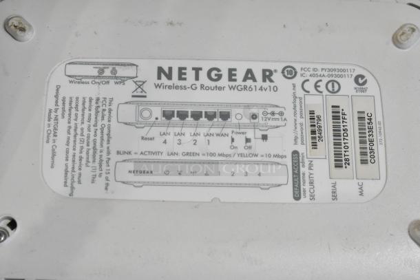 Netgear Wireless-G Router WGR614v10 label, detailing ports, reset button, power, FCC ID, and serial numbers. Used condition.