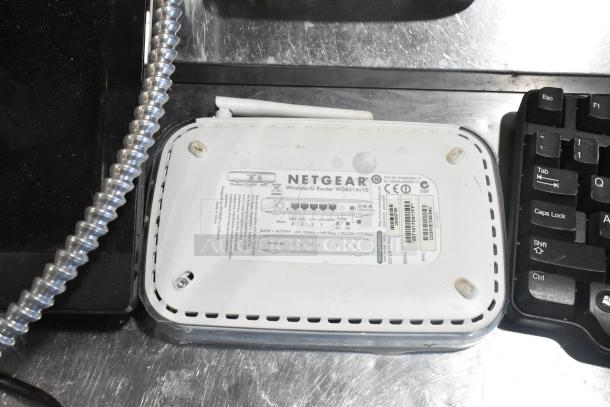 Netgear Wireless-G Router WGR614v10, visible label with ports, next to a keyboard, part of a 10-item auction bundle.