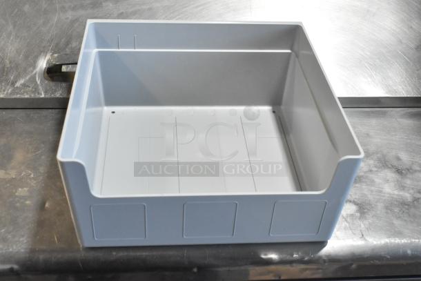 Brand new 104976V2GY condiment bin large, gray plastic, minor scratches, durable material, ideal for kitchen organization.