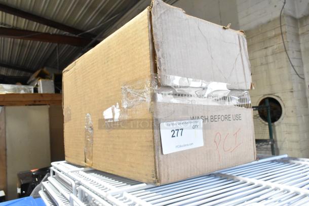 Cardboard box labeled "104976V2GY Condiment Bin Large." New but with scratch and dent. Auction tag reads "PCI, Lot 277."