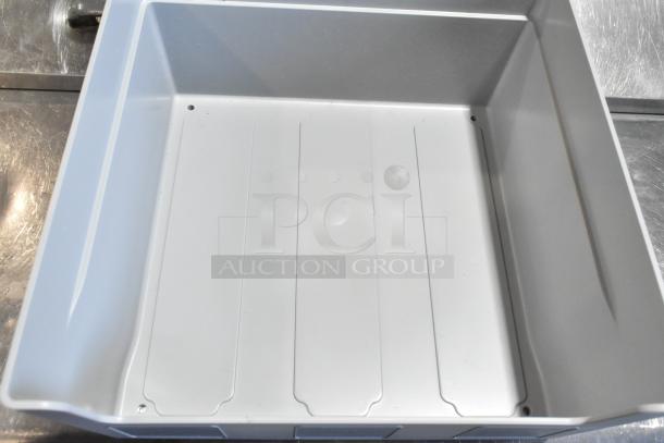 Brand new large condiment bin, model 104976V2GY. Slight scratches and dents. Durable, ideal for kitchen use.