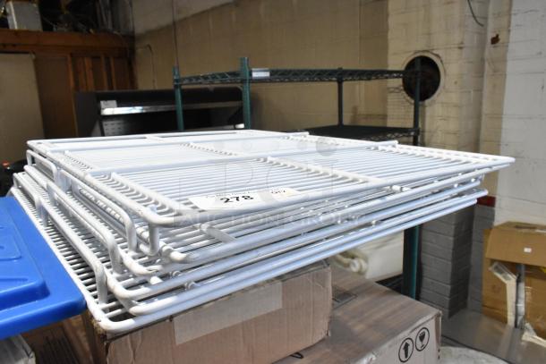 Lot of 6 poly-coated racks stacked, in good condition. Visible tag reads "278." Ideal for storage use.
