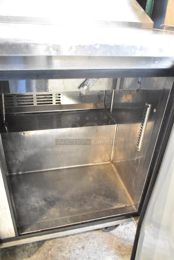Turbo Air TST-48SD stainless steel sandwich prep table. Features a spacious interior, commercial casters, and a thermometer.