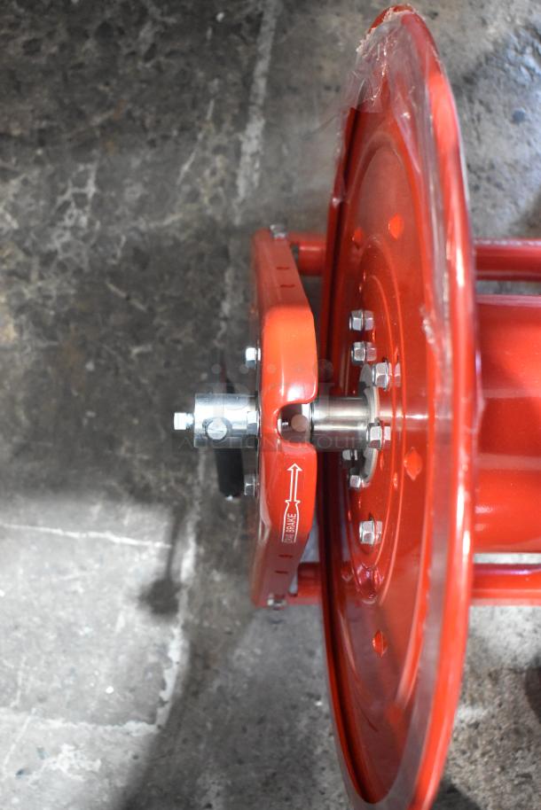Reelcraft CA32112 L red metal hose reel, features sturdy construction and brake indicator, shown in excellent condition.