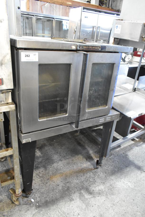 Bakers Pride 456GDCOER21 stainless steel commercial convection oven with view-through doors and metal racks.