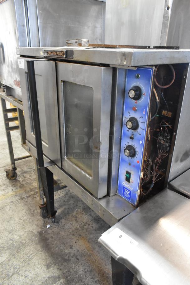 Bakers Pride 456GDCOER21 stainless steel convection oven, with view through doors, metal racks, and thermostatic controls.