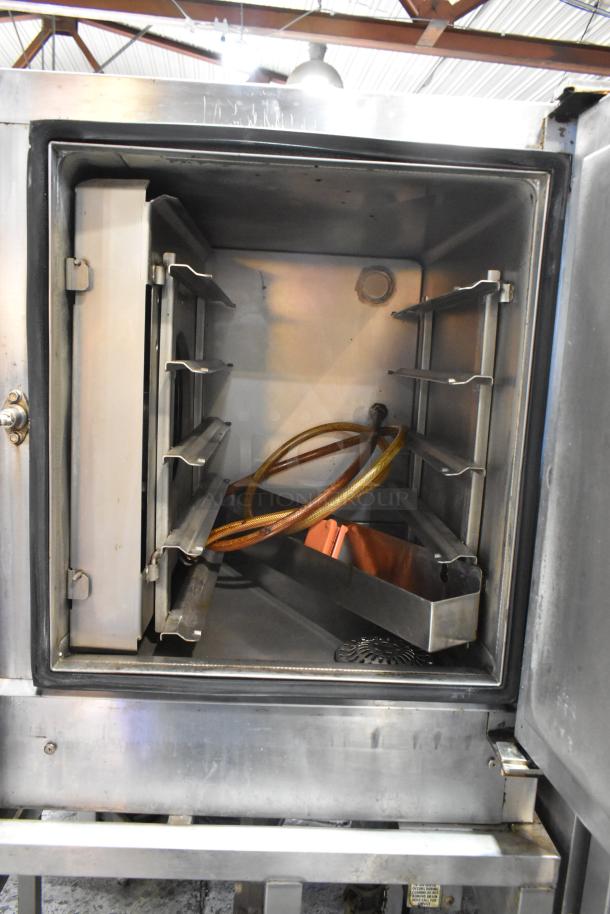 Blodgett 45GEC stainless steel commercial oven with electric power, 208V, 3-phase; on commercial casters, open door view.