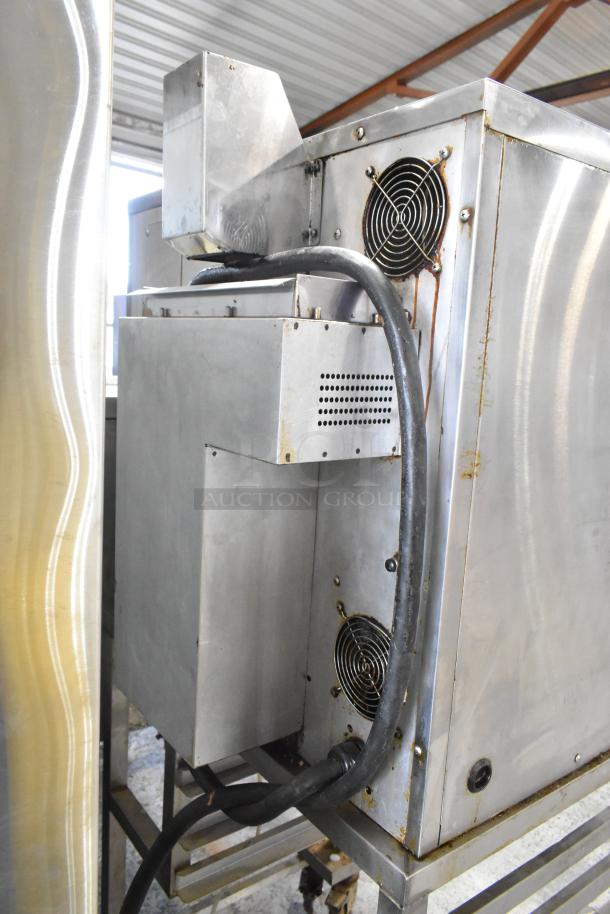 Blodgett 45GEC stainless steel commercial oven on casters, 208V, 3 phase. Visible wear, equipped with rear ventilation fans.