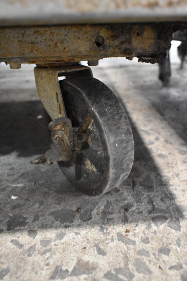 Randell 8268N pizza prep table caster, showing rust and wear, indicating used condition.