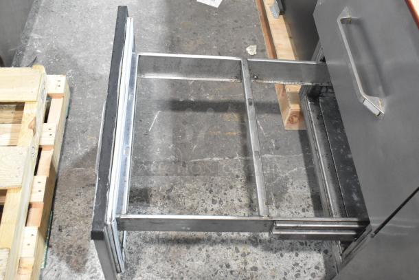 Randell 8268N stainless steel pizza prep table, featuring two drawers, one door, and commercial casters. 115 volts, 1 phase.