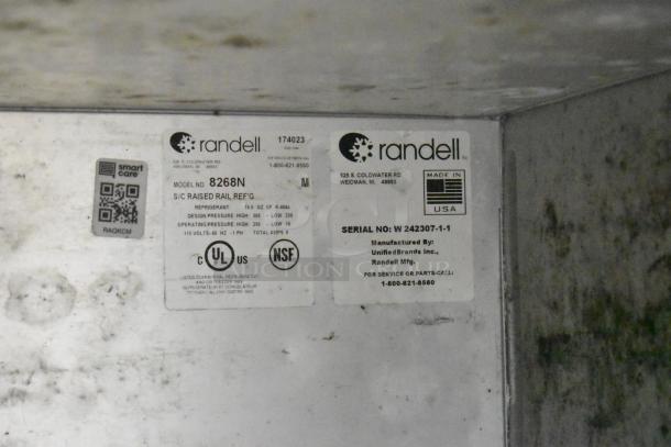Randell 8268N stainless steel pizza prep table, 2 drawers, 1 door, commercial casters. 115V, 1 Phase. Labels show model info.