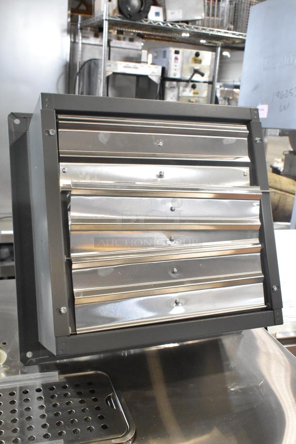 Brand new Canarm S12-E1 12" wall exhaust fan, scratch and dent condition, 1-speed, metallic finish.