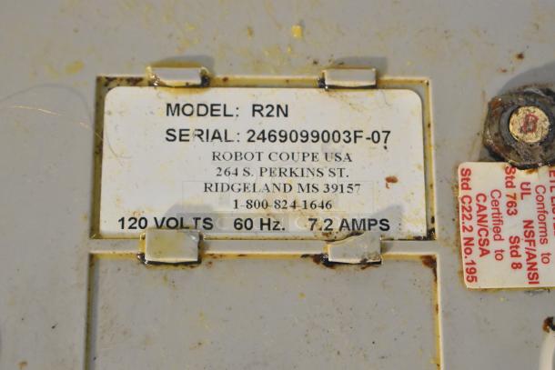 Robot Coupe R2N food processor label indicating 120 volts, 60 Hz, 7.2 amps, with model and serial numbers visible.