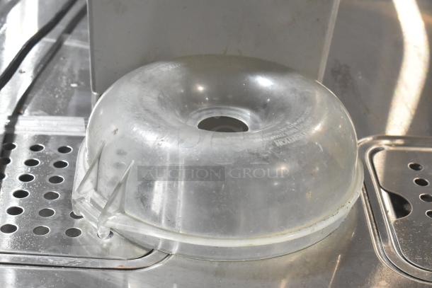 Robot Coupe R2N food processor lid on metal surface, slightly used condition, clear plastic.