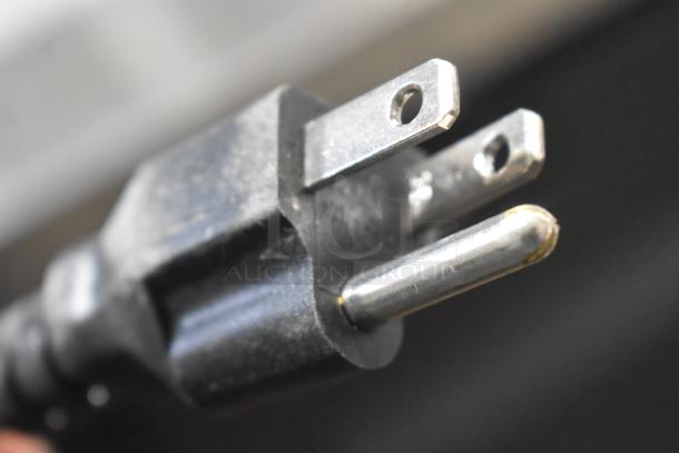 Close-up image of a three-pronged electrical plug from the 2025 Avantco 178UDD72HC kegerator.
