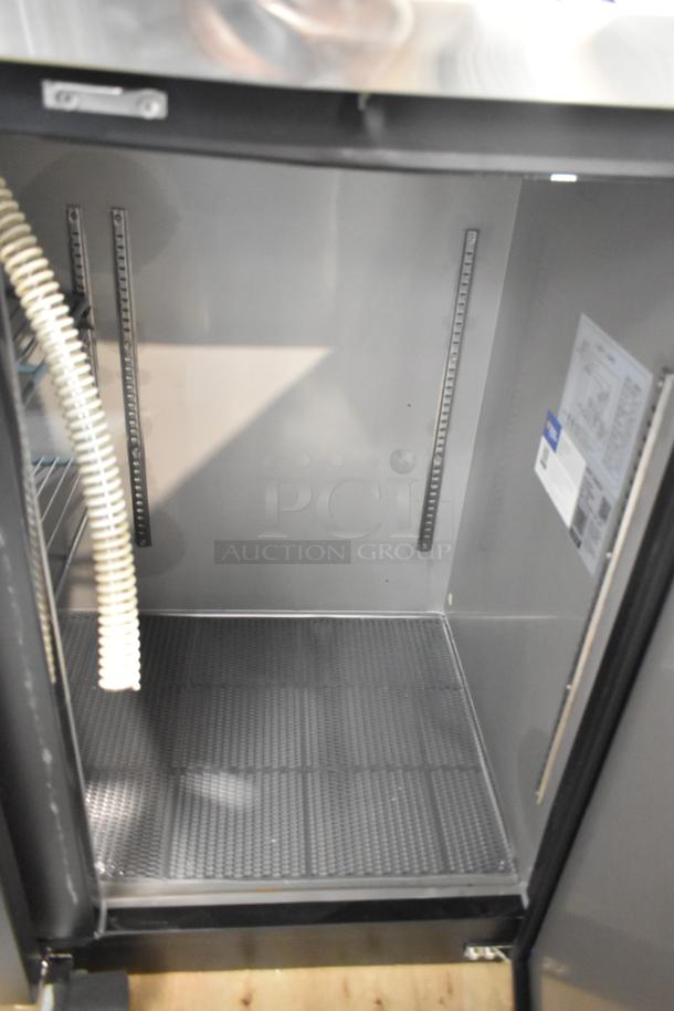 2025 Avantco 178UDD72HC kegerator interior, black metal, brand new with minor scratches. Holds three 1/2 kegs, 115V.