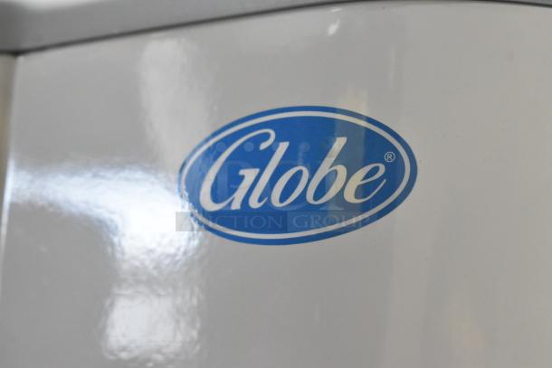 Alt text: Globe SP5 mixer logo, close-up on white surface.