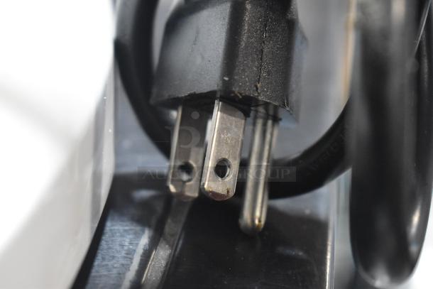 Close-up of a power plug for a 2024 Globe SP5 dough mixer, indicating 110 volts, 1-phase power requirement.
