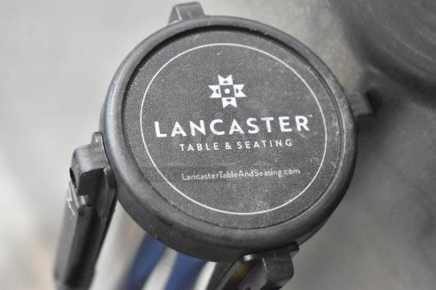 Chrome finish stanchions by Lancaster Table & Seating, brand new with minor scratches, logo visible on top, auction lot includes two.