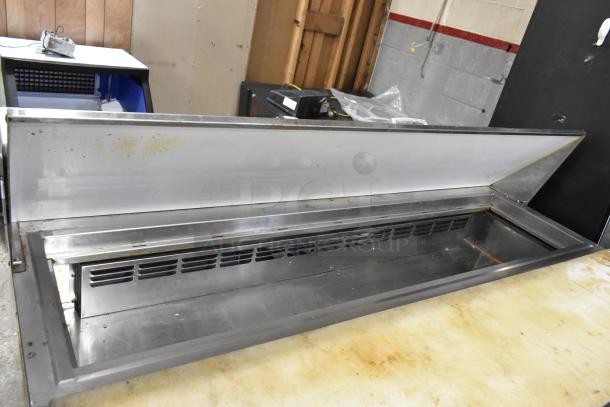 Everest stainless steel commercial sandwich salad prep table, mega top, four drawers, on casters. 115 volts, 1 phase.