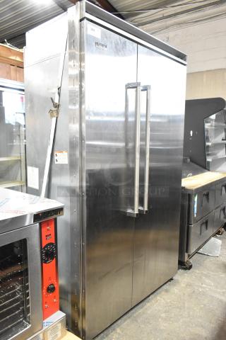 Viking stainless steel reach-in cooler with freezer, featuring dual doors and sleek handles in good condition.