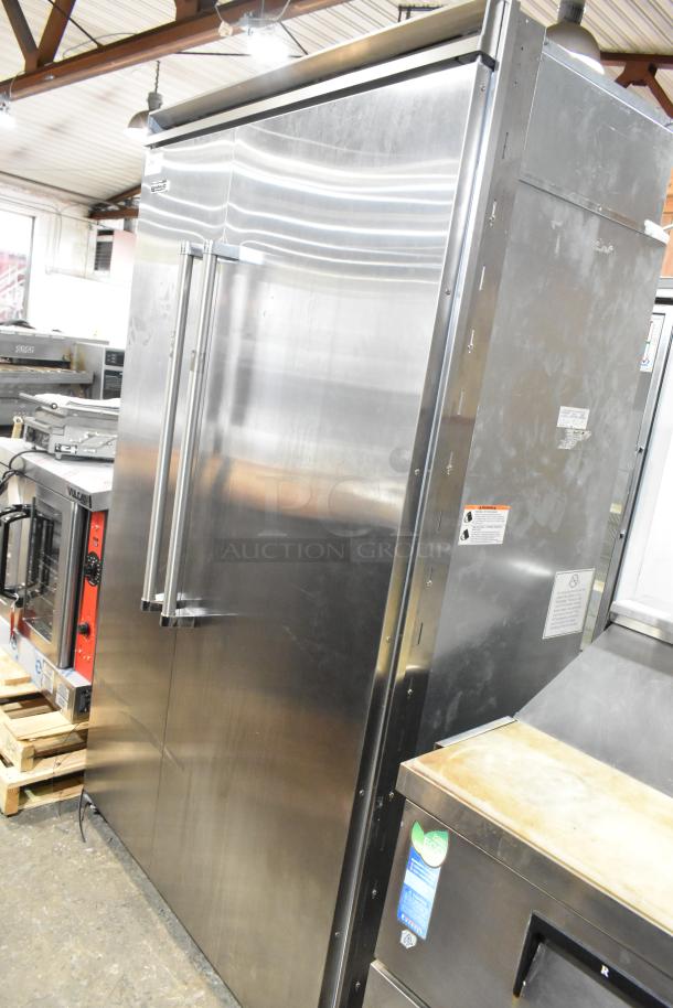 Viking stainless steel reach-in cooler with freezer, dual doors, excellent condition, visible labels indicating model and safety info.