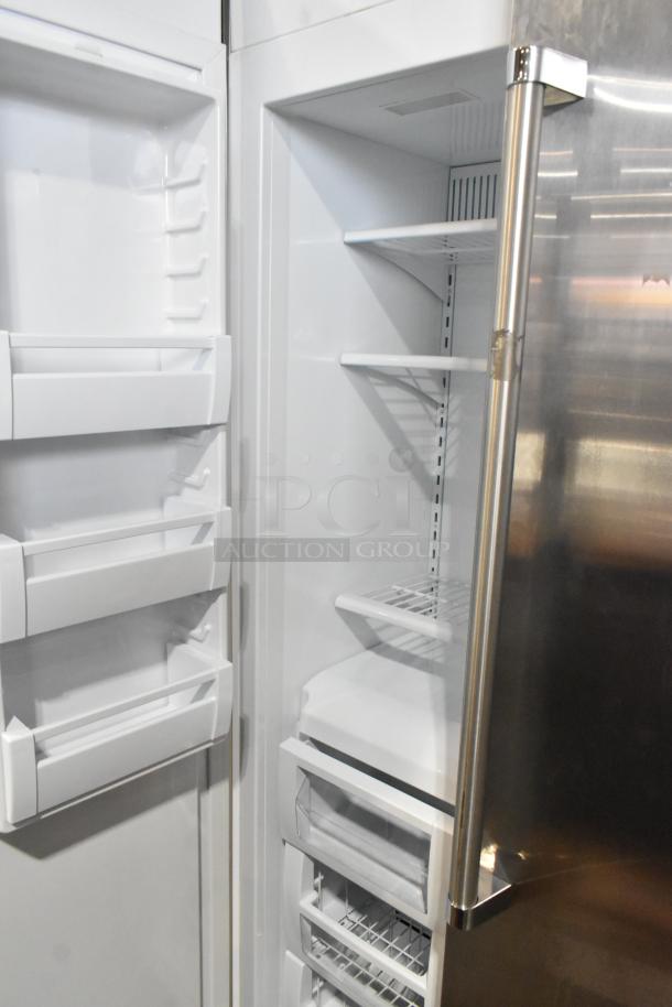 Viking stainless steel reach-in cooler with freezer, sleek design, multiple shelves, excellent condition.