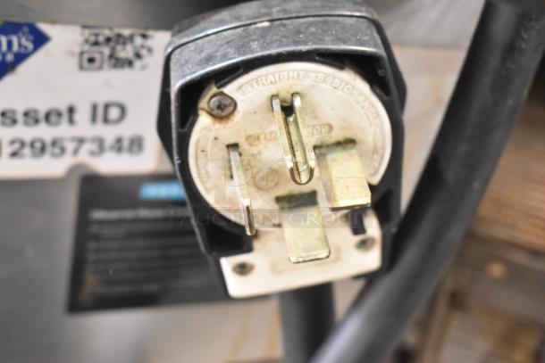 Close-up of the plug and asset ID tag for a 2017 Turbochef HhC2020 commercial oven, 208/240V, 3 phase.