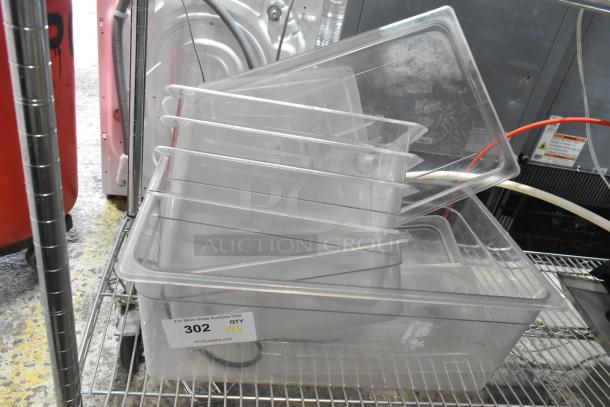 Lot of 6 clear poly bins stacked on a metal shelf, used condition. Label reads "302 QTY VXL PCIauctions.com."