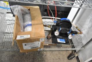 Kay Water Filtration System, includes gauges and tubing, in original packaging. Box label indicates model NAT-10442.