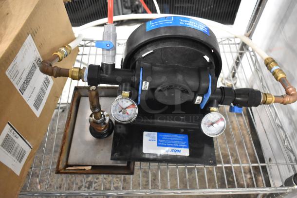Kay Water Filtration System with pressure gauges, valves, and labeled connections on a metal frame. Good condition.