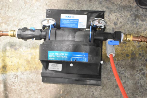 Kay Water Filtration System, featuring dual pressure gauges, instructional label for cartridge alignment, inspected in 2019.