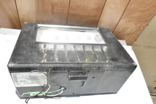 General Electric GE WMRETRO3-088 light in used condition, black casing with visible wear and a label with wiring details.