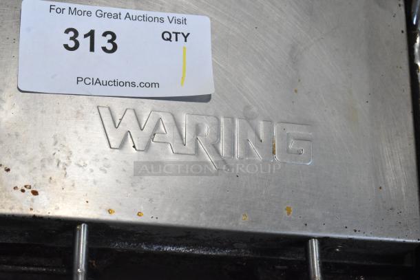 Waring WPG150 Stainless Steel Panini Press, 120V, 1 Phase, visible wear, embossed logo, auction tag 313, PCI Auctions.