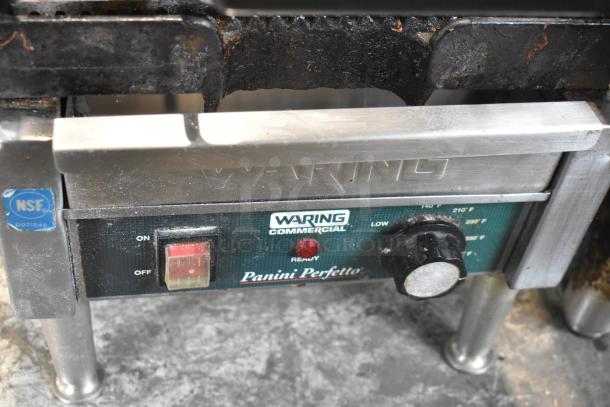 Waring WPG150 stainless steel commercial panini press, 120 volts, ON/OFF switch, temperature dial, NSF certification visible.