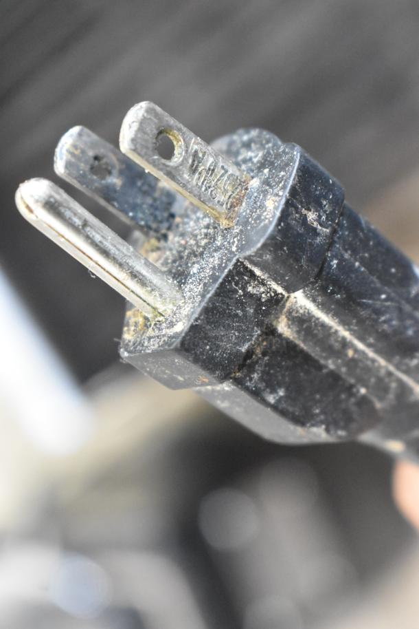 Close-up of a power plug for the Waring WPG150 Stainless Steel Commercial Countertop Panini Press. 120V, 1 Phase.