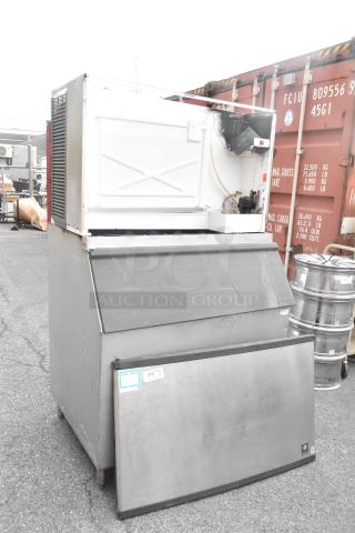 Manitowoc QY1305 stainless steel commercial ice head on bin, 208-230V, 1 phase. Used condition with visible wear.