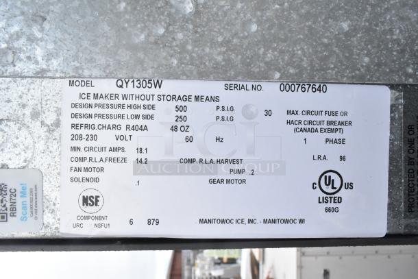 Manitowoc QY1305 stainless steel commercial ice head on ice bin, 208-230 volts, 1 phase. Label shows specs and certifications.