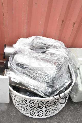 Lot of various items, including Fetco TPD-15 Luxus Beverage Holder Dispensers and a panini press, wrapped in plastic.