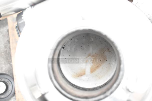 Interior of a Fetco TPD-15 Luxus beverage dispenser showing minor stains and wear, indicating used condition.