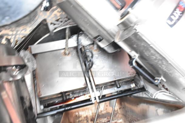 Lot of various items, featuring Fetco TPD-15 Luxus beverage holder dispensers and a panini press, mixed condition.