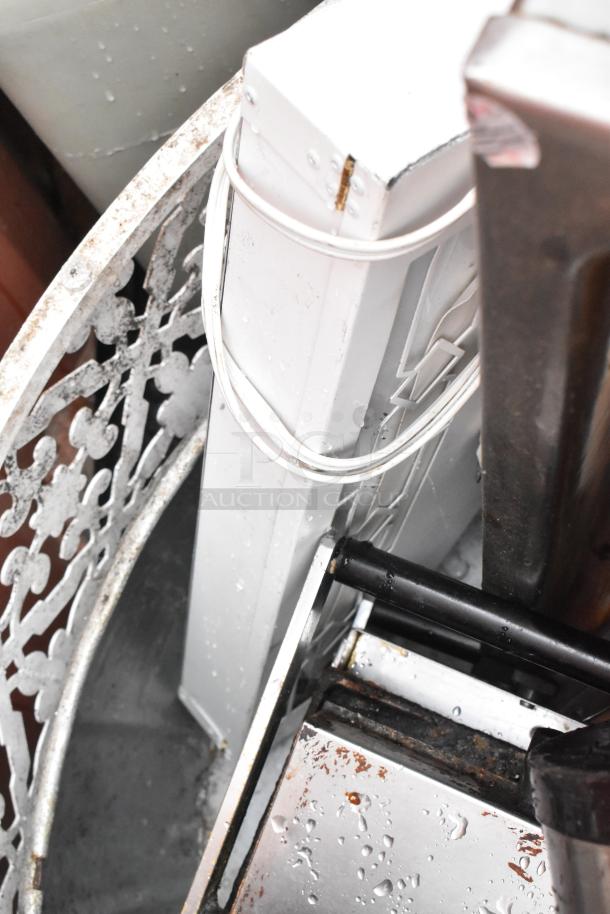 Lot of various items including Fetco TPD-15 Luxus beverage dispensers and a panini press, visible wear and rust.