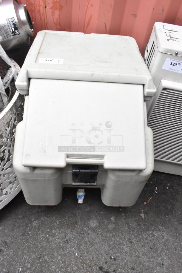 Cambro poly portable ice transport bin on casters, used condition, branded "CAMBRO", features secure latch and drainage spout.