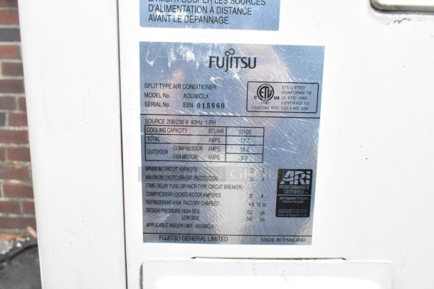 Fujitsu AOU36CLX split type air conditioner label, 33,100 BTU, 208/230V, 1 phase, showing model and serial number, in good condition.